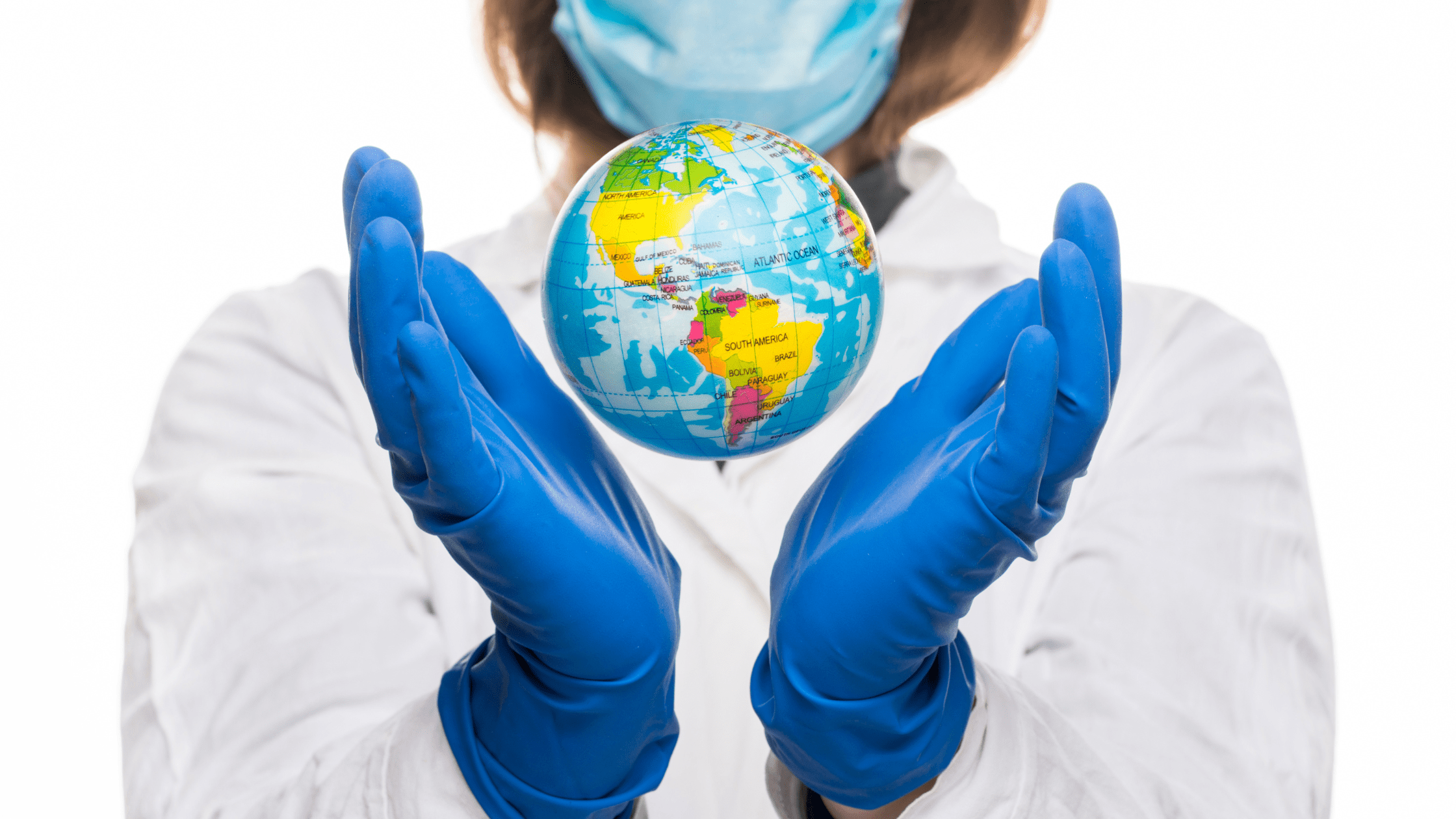 An IMG resident holding a globe.